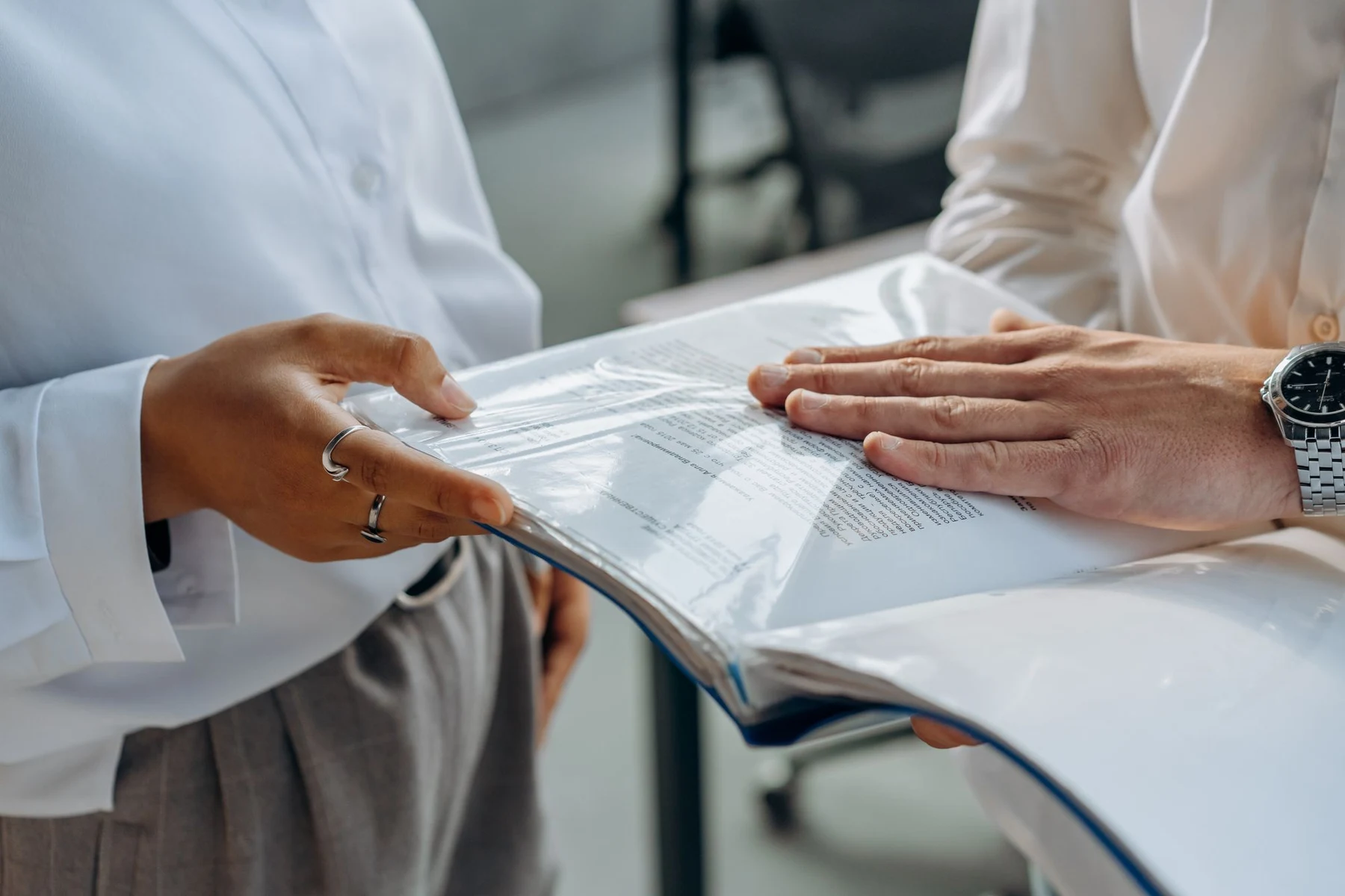 Business professionals discussing documents during a meeting