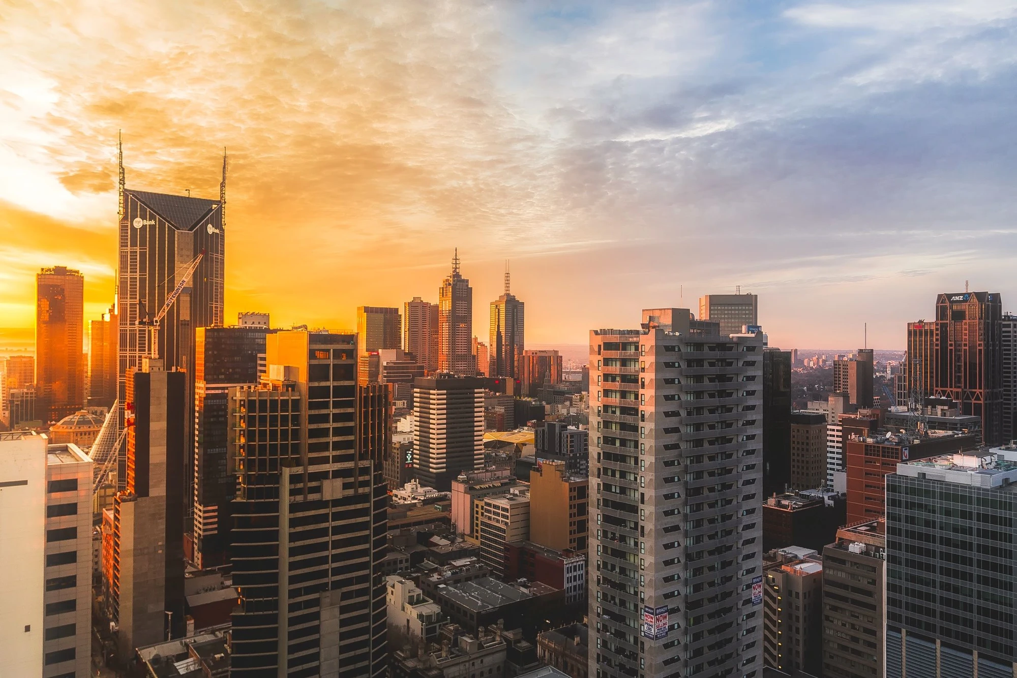 Melbourne city skyline in warm golden evening light
